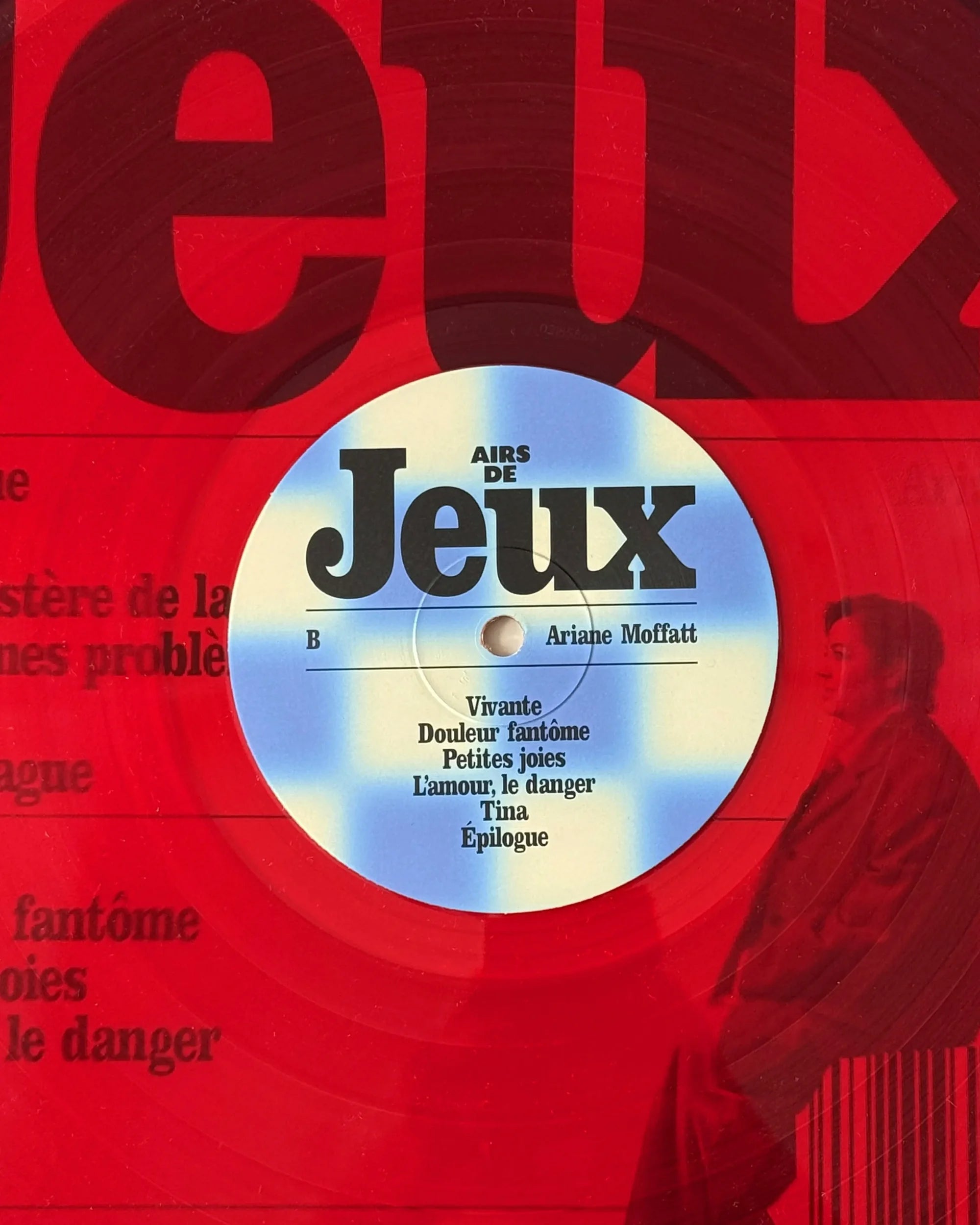 Airs de Jeux — vinyle rouge, face B, étiquette « Jeux » et pochette en arrière-plan