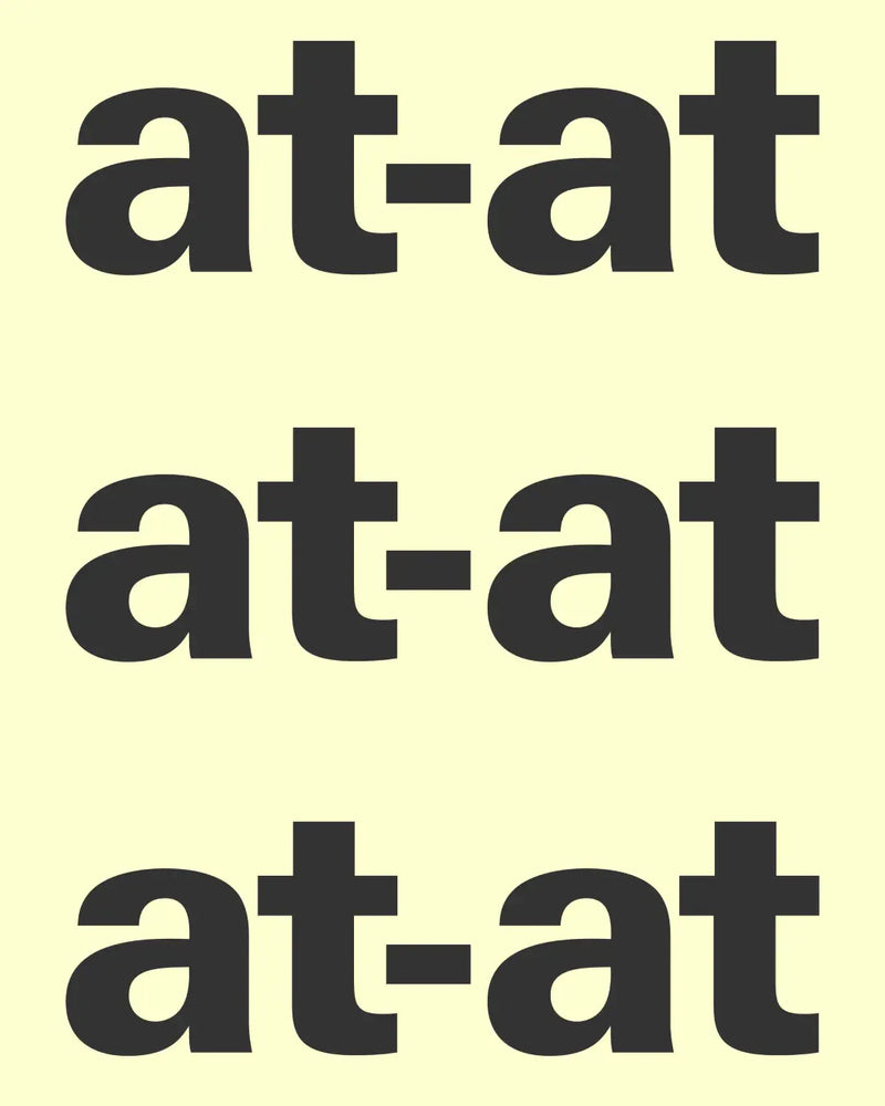 at-at — wordmark noir répété trois fois sur fond jaune pâle