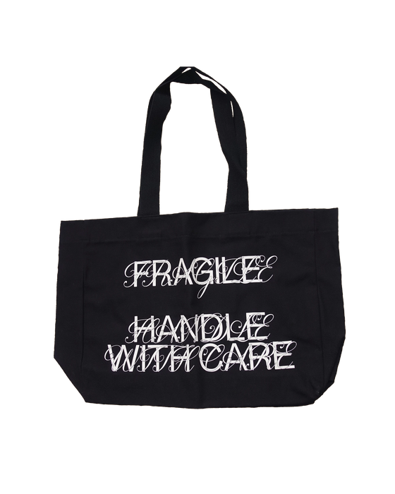 Tote bag noir Fragile Handle With Care, sur fond noir